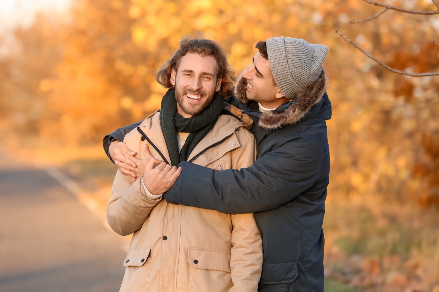 A male couple sharing a warm embrace