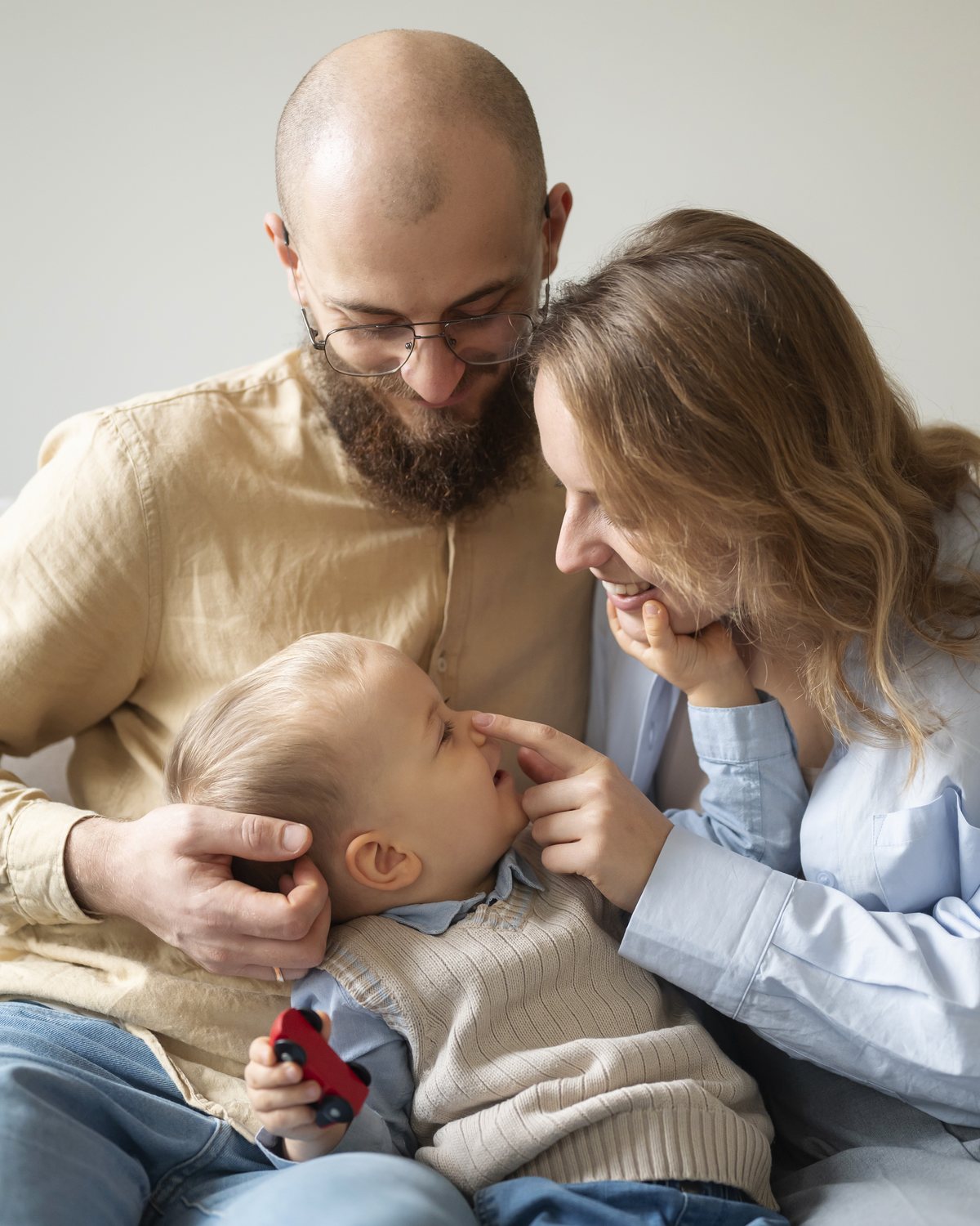 A heterosexual couple with their baby